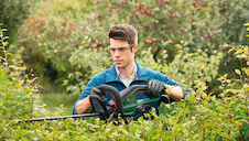 Akumulátorové nůžky na živé ploty UniversalHedgeCut 18V-50